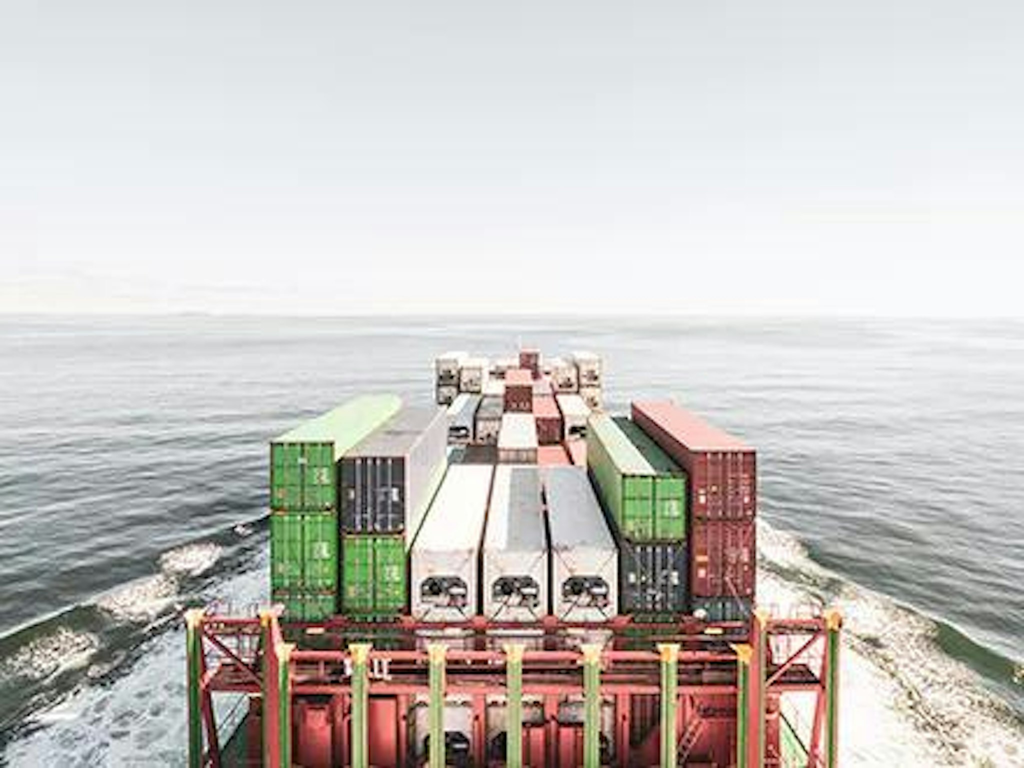 Image of crates on a ship representing business carbon offsetting