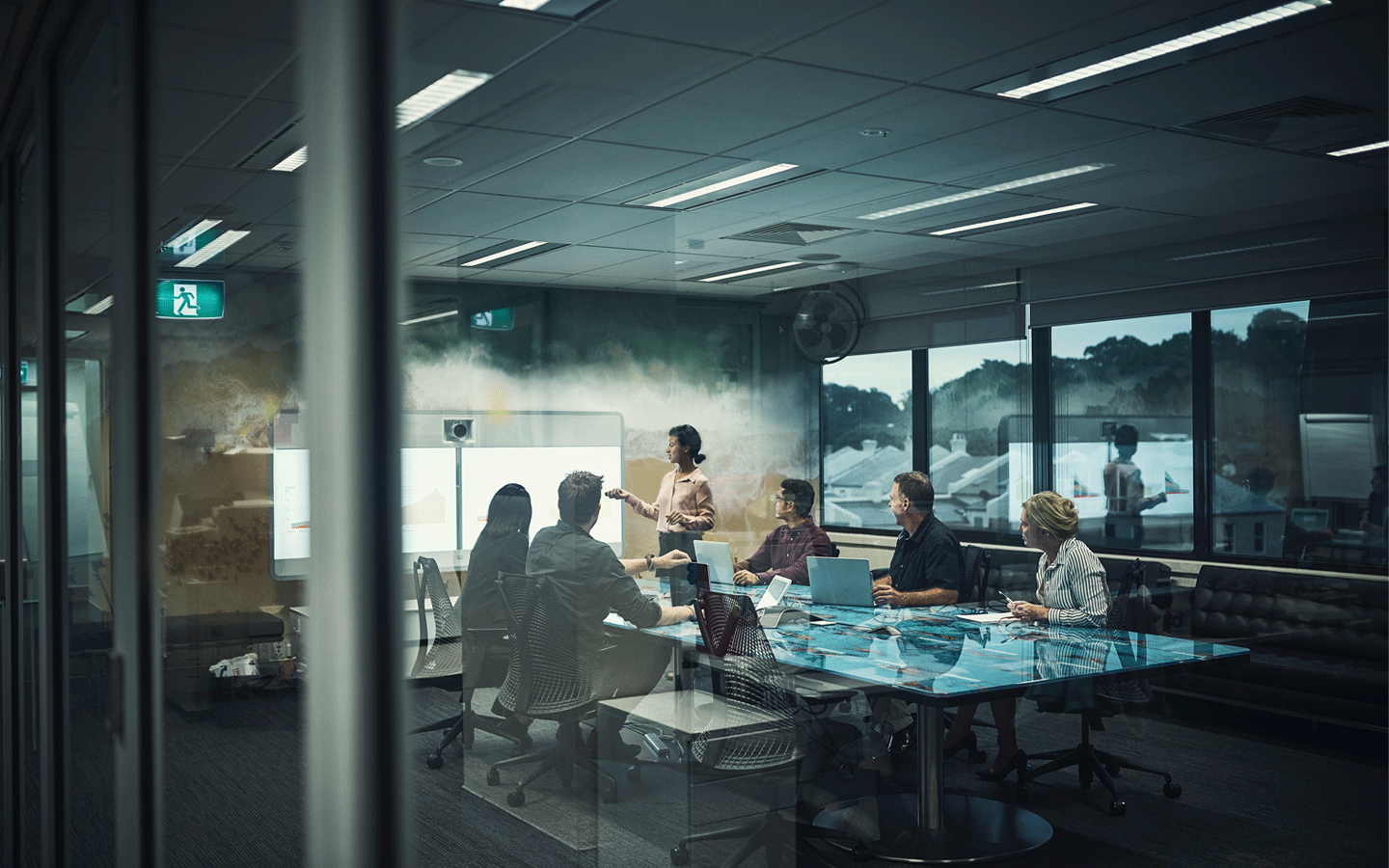 women presenting in boardroom