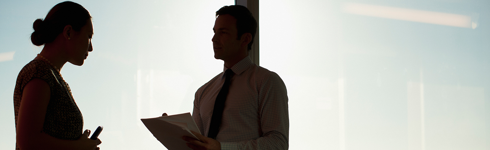 Coworkers discussing the ITIL framework