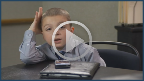 Video preview thumbnail - Child sat at table with hand on head