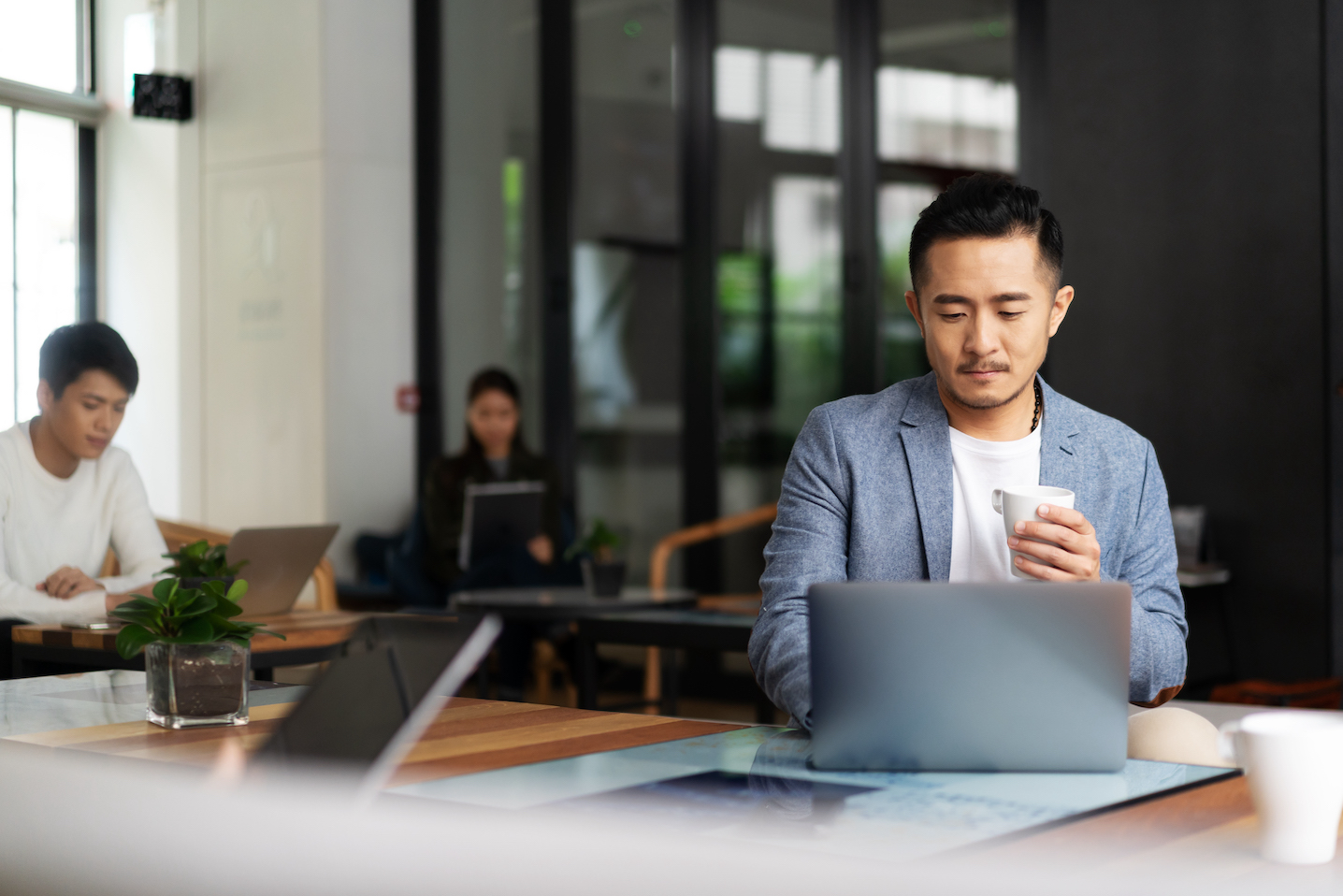 Man using laptop in business setting