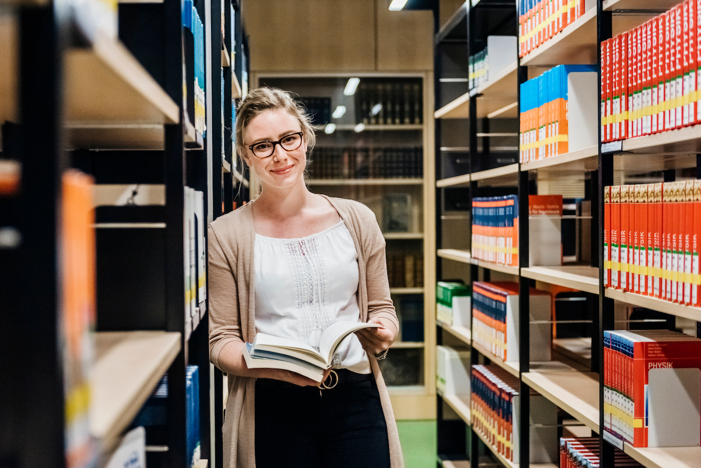 Woman smiling in library setting