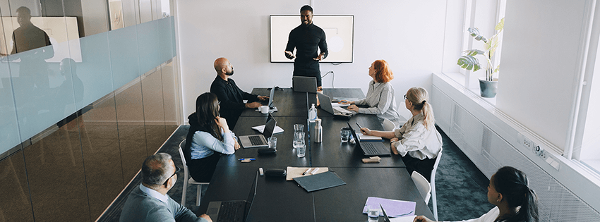 Group of people in an office room conducting a meeting
