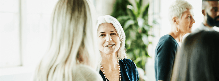Woman among other people at a business networking event
