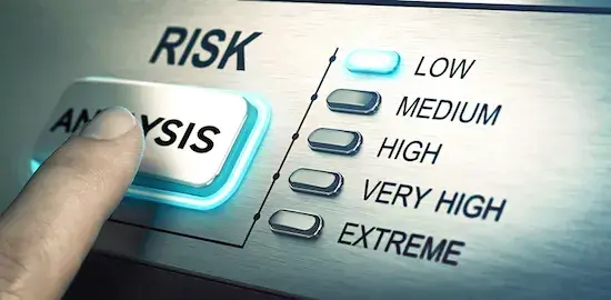 A person pressing an 'analysis' button to signify the annual risk assessment process.