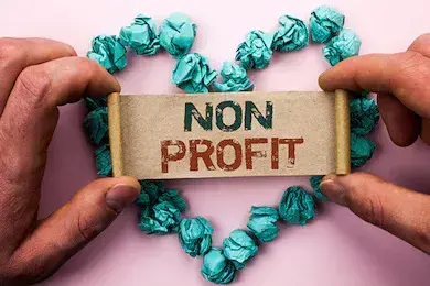 Illustration of board member holding building block with the words nonprofit