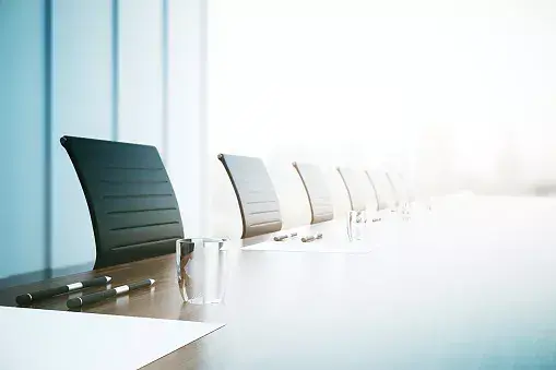 Boardroom with strategy documents illustrating the processes of building a strong governance model