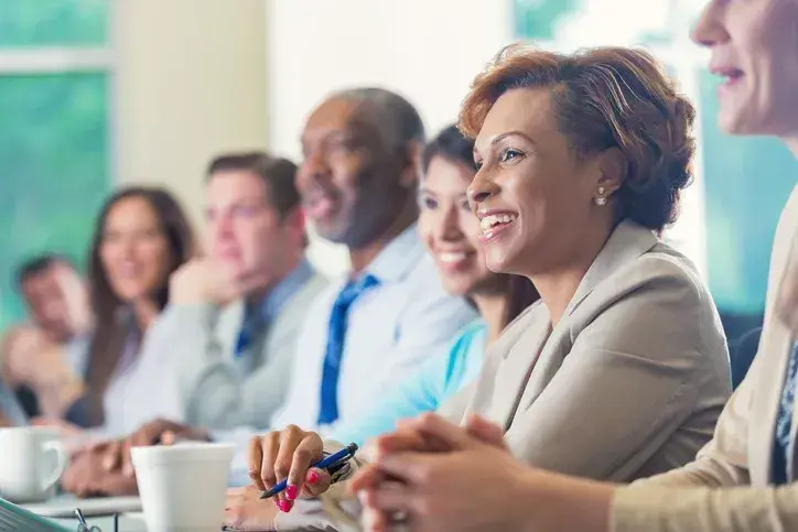 A board liaison having a meeting with a school board