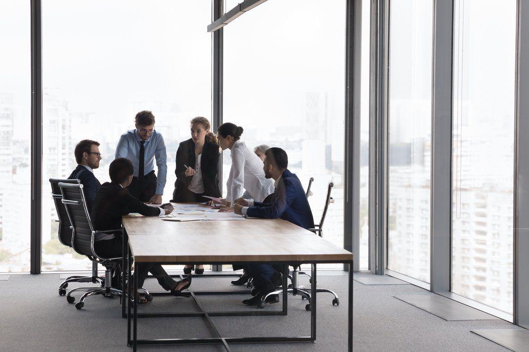 A parent company holding a meeting about their subsidiary company