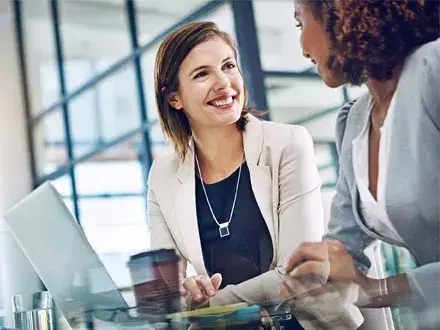 Two colleagues representing a diverse board