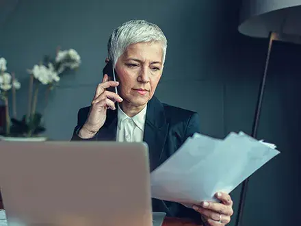 Executive looking over her organization's latest ESG disclosures.