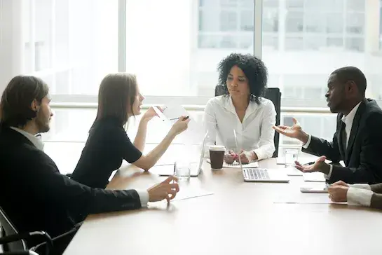 Legal compliance professionals at a table.