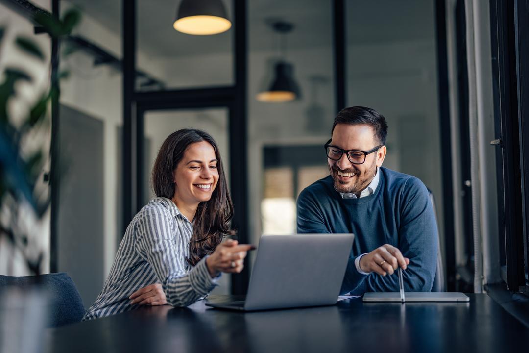 Board members using paperless board management software