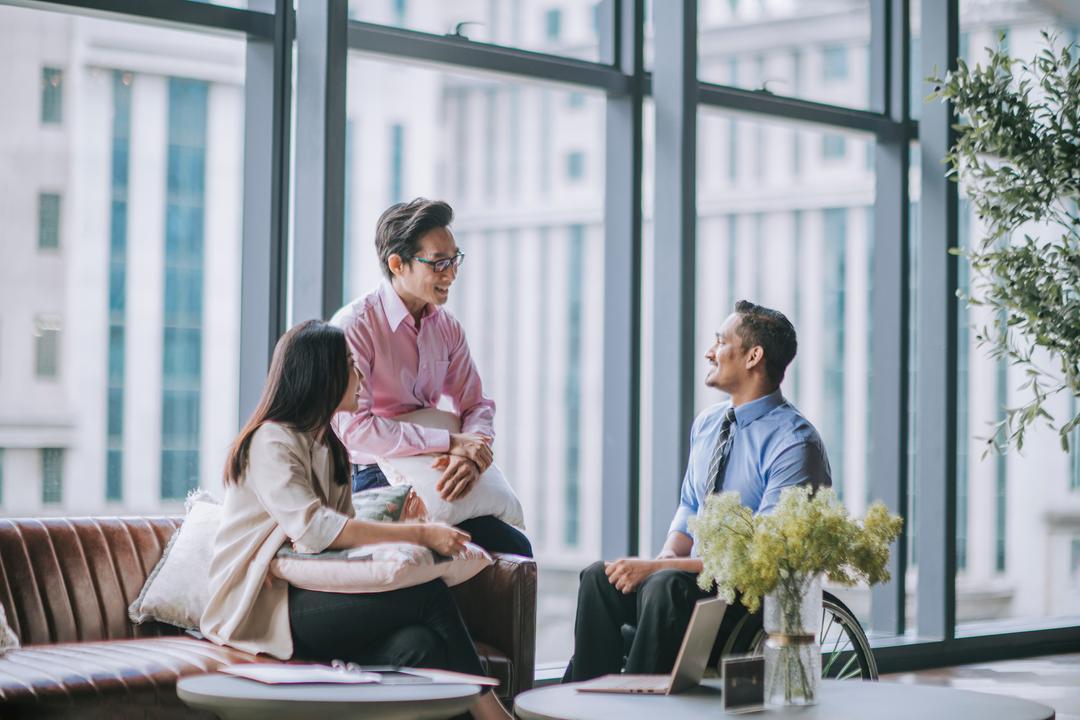 Colleagues discussing their subsidiary management plan