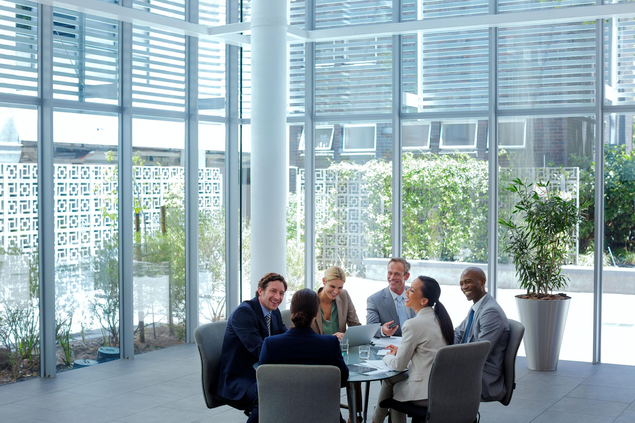Business people discussing Diligent ACL Analytics features