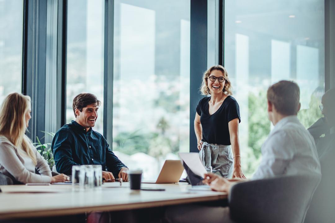 A board meeting where meeting minutes are being taken using the 14 step guide