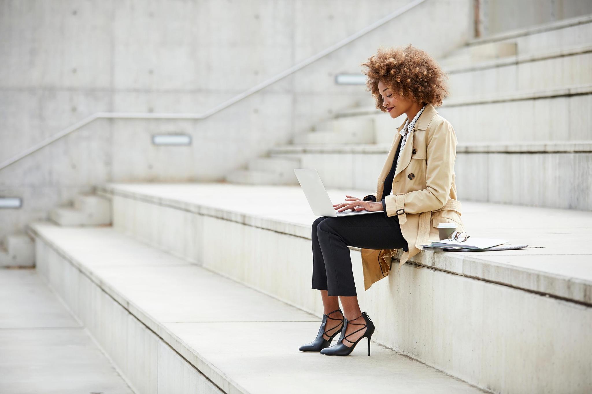 Person using laptop to review the differences between centralized or distributed to understand what is best for enhanced information securitydatabase 