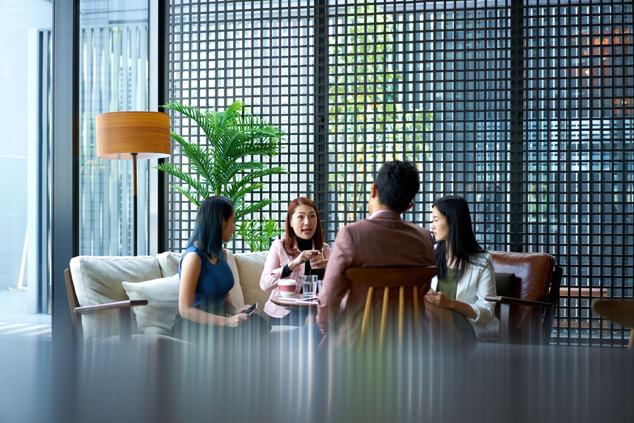 Professionals discussing the implications of AI on business