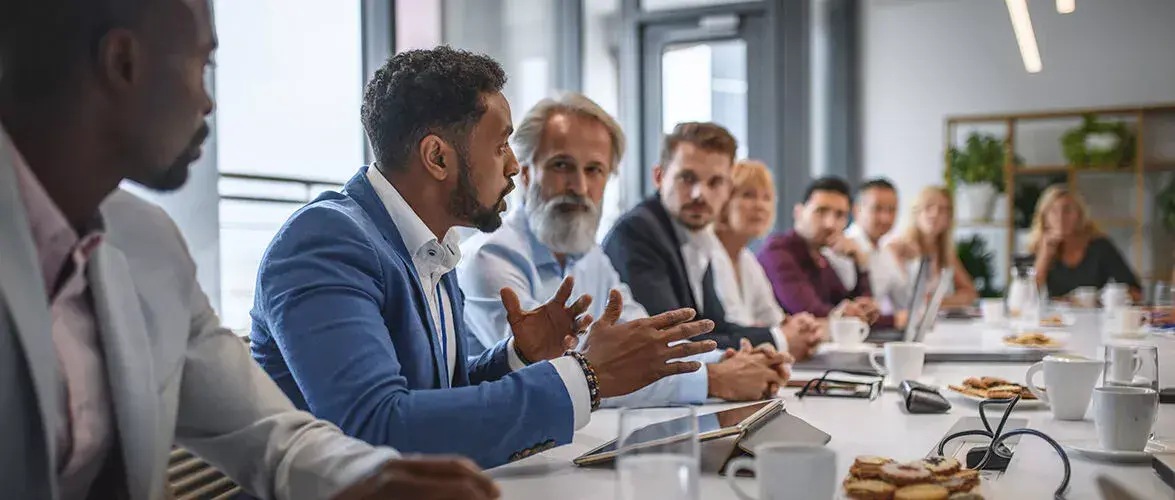 Members of a community college board having a meeting