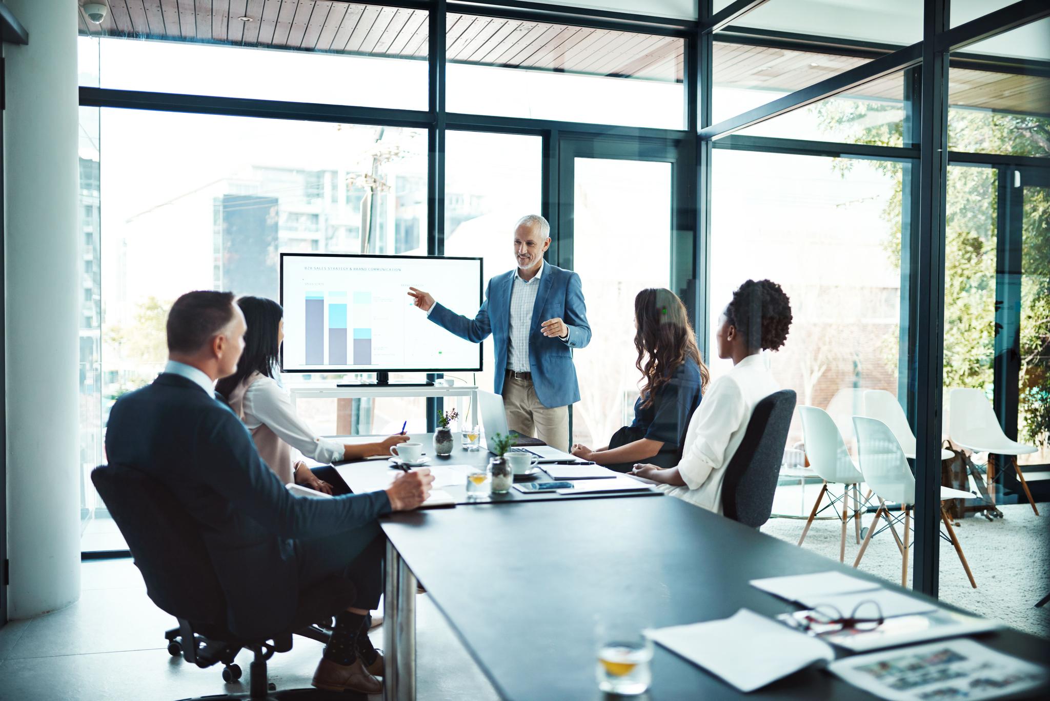 CISO presenting to a board of directors in a conference room