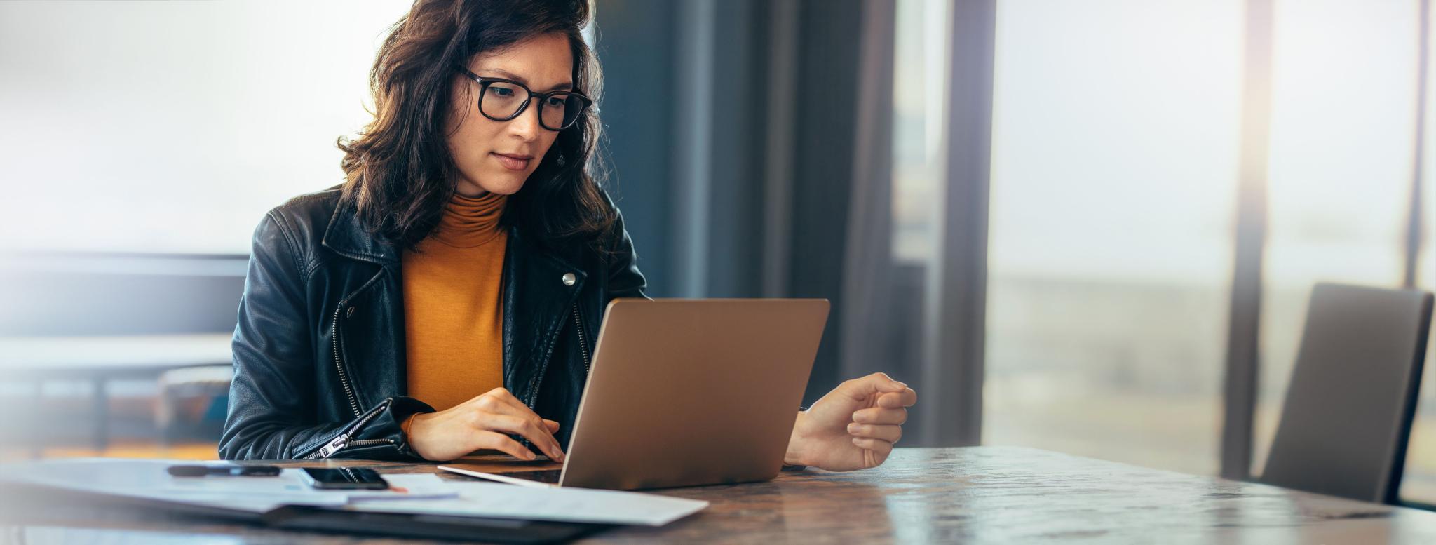 female compliance leader reading about new modern slavery legislation
