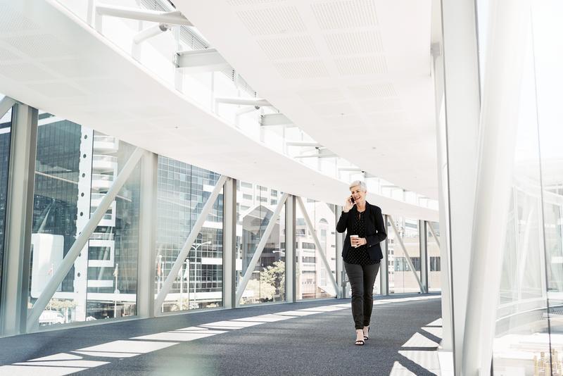 Person deals with crisis on the phone while rushing to board meeting