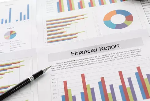 Financial reports displaying charts and the words "financial report" written on it, demonstrating the annual report.