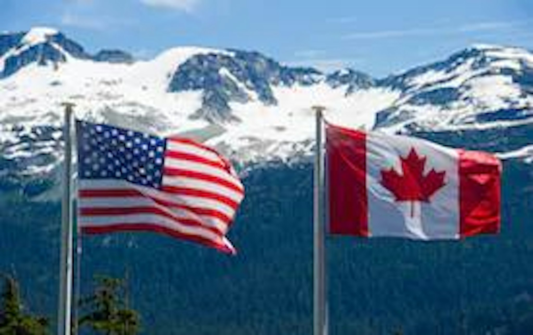 US and Canadian flag representing things to consider when incorporating in those countries