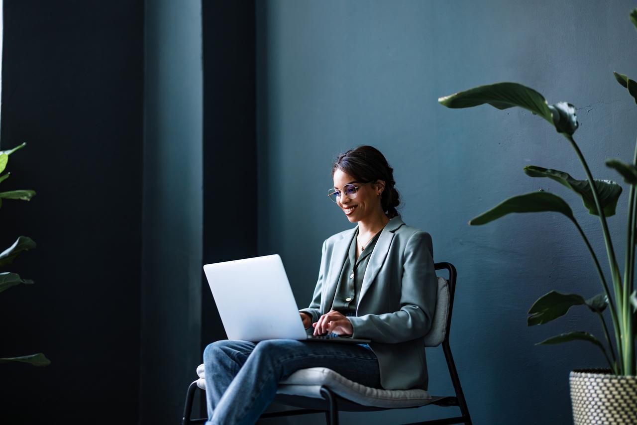 Business person reading tips during Cybersecurity Awareness Month