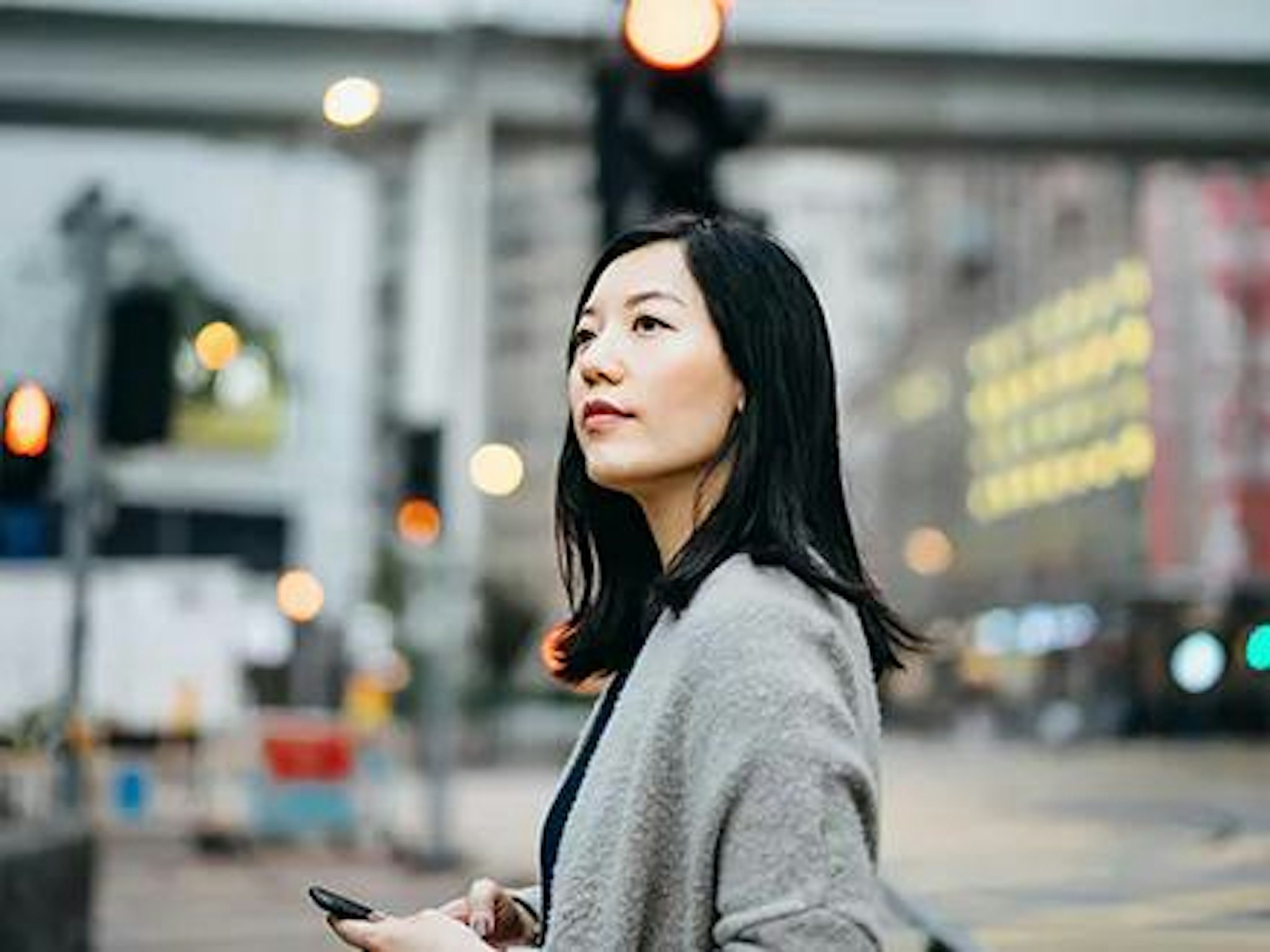 Lady walks through city considering why governance is the secret of success in digital transformation