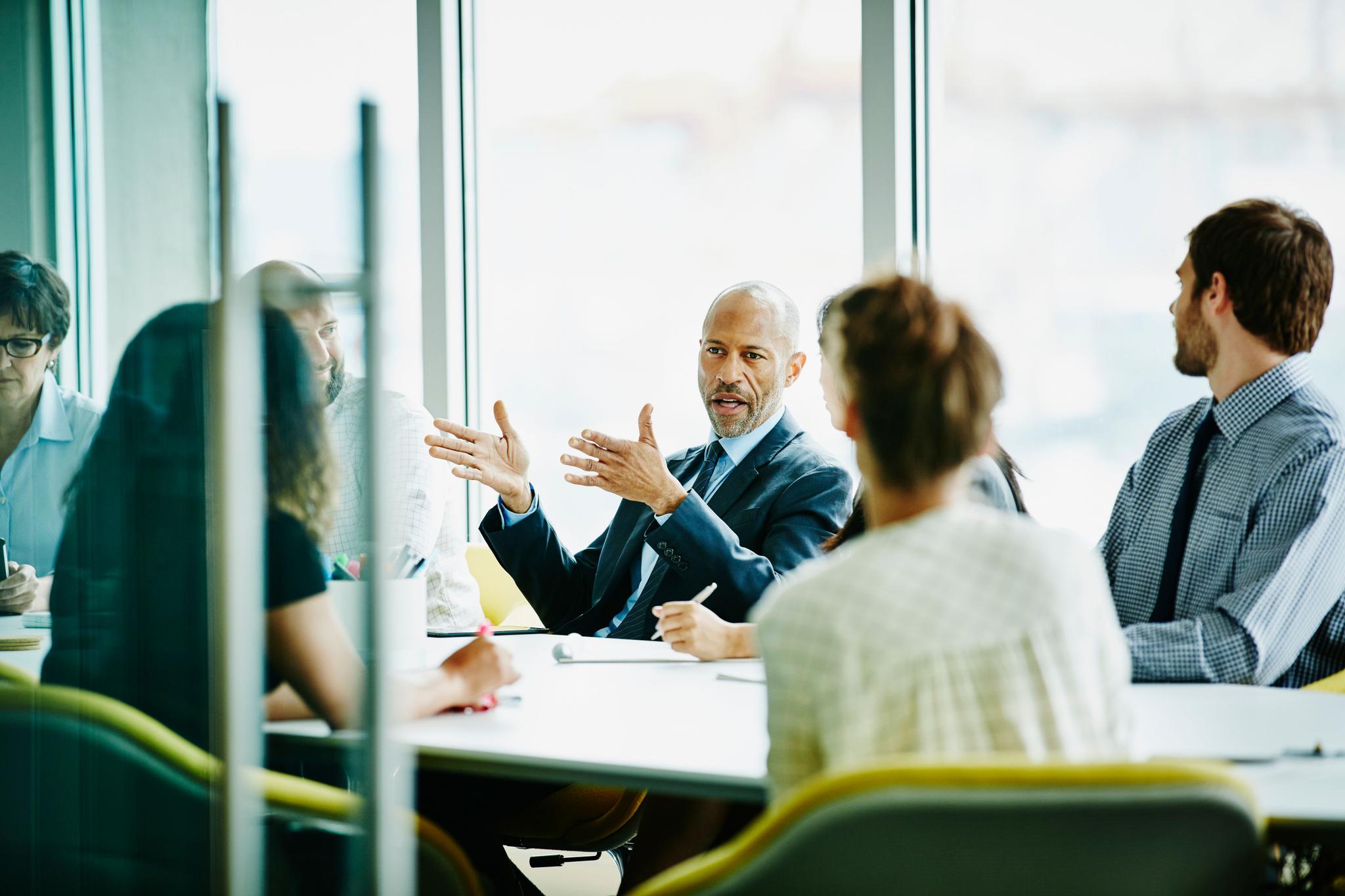 Businessman leading risk meeting in office
