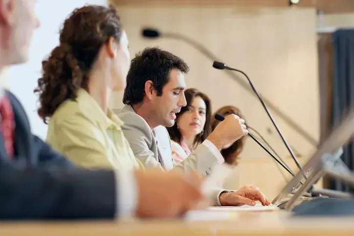 The public speak at governmental meeting.