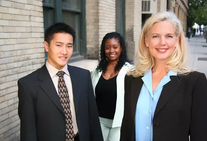 A group of professionals outside the city clerk's office.