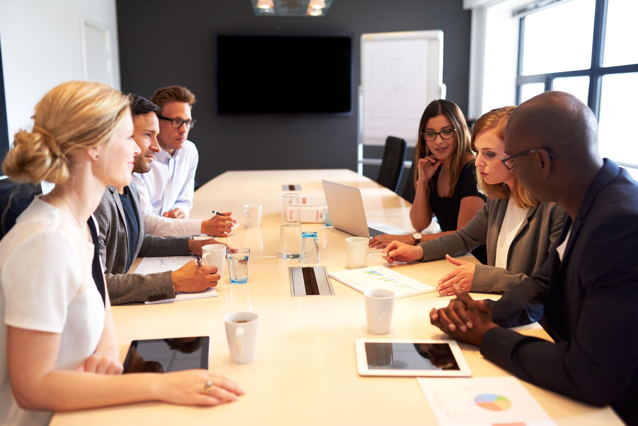 Group of executives having meeting in conference room