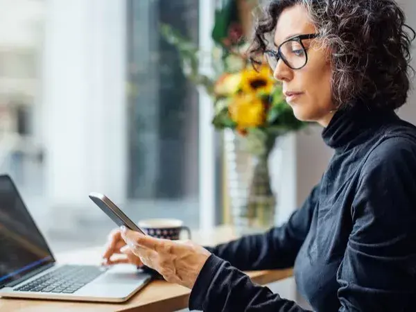 Woman using Diligent software within their company