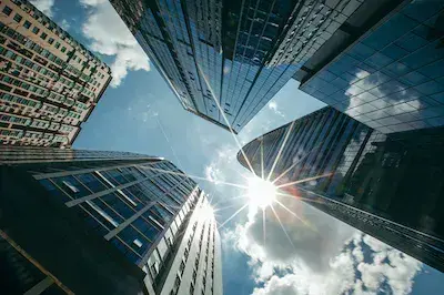 Image illustrating the role of the board and executive team during restructuring by showcasing a towering building symbolizing the organization's structure and resilience, reflecting the important role of the board and executive team in overseeing and guiding the restructuring process.