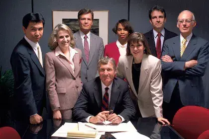 Board of directors huddled together for group photo