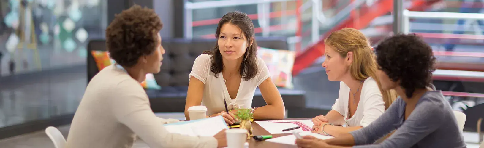 Professionals discussing best practices for creating robust audit committee reports.