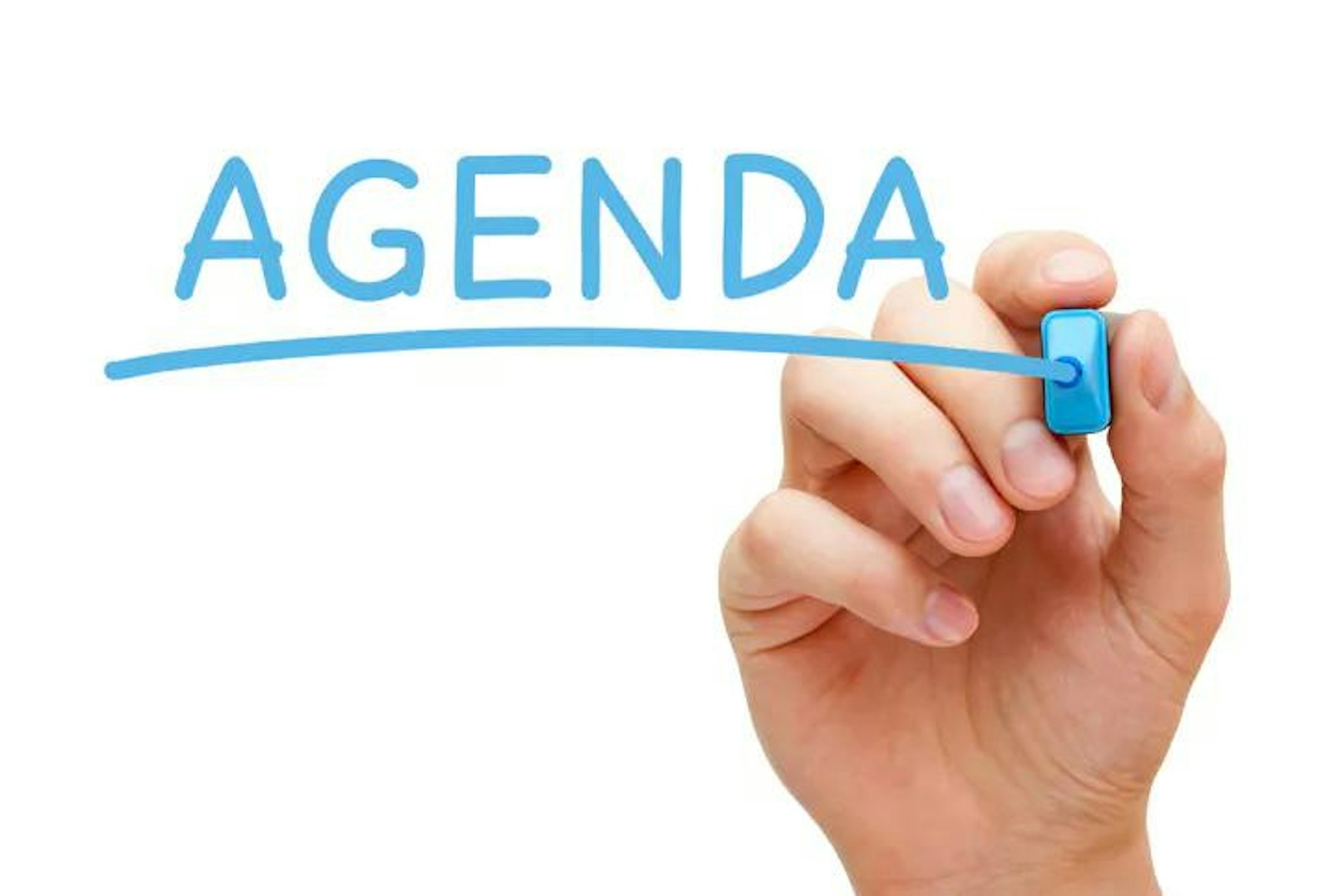 Person has written 'agenda' to signify a school board meeting agenda template.