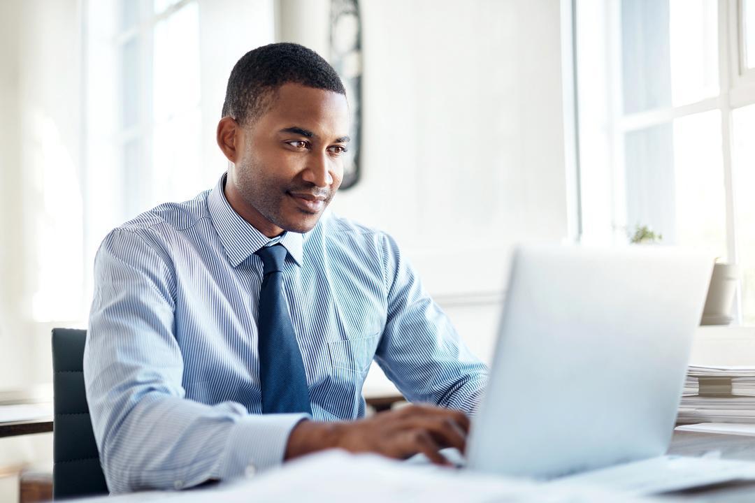 a young compliance professional works on continuous career development