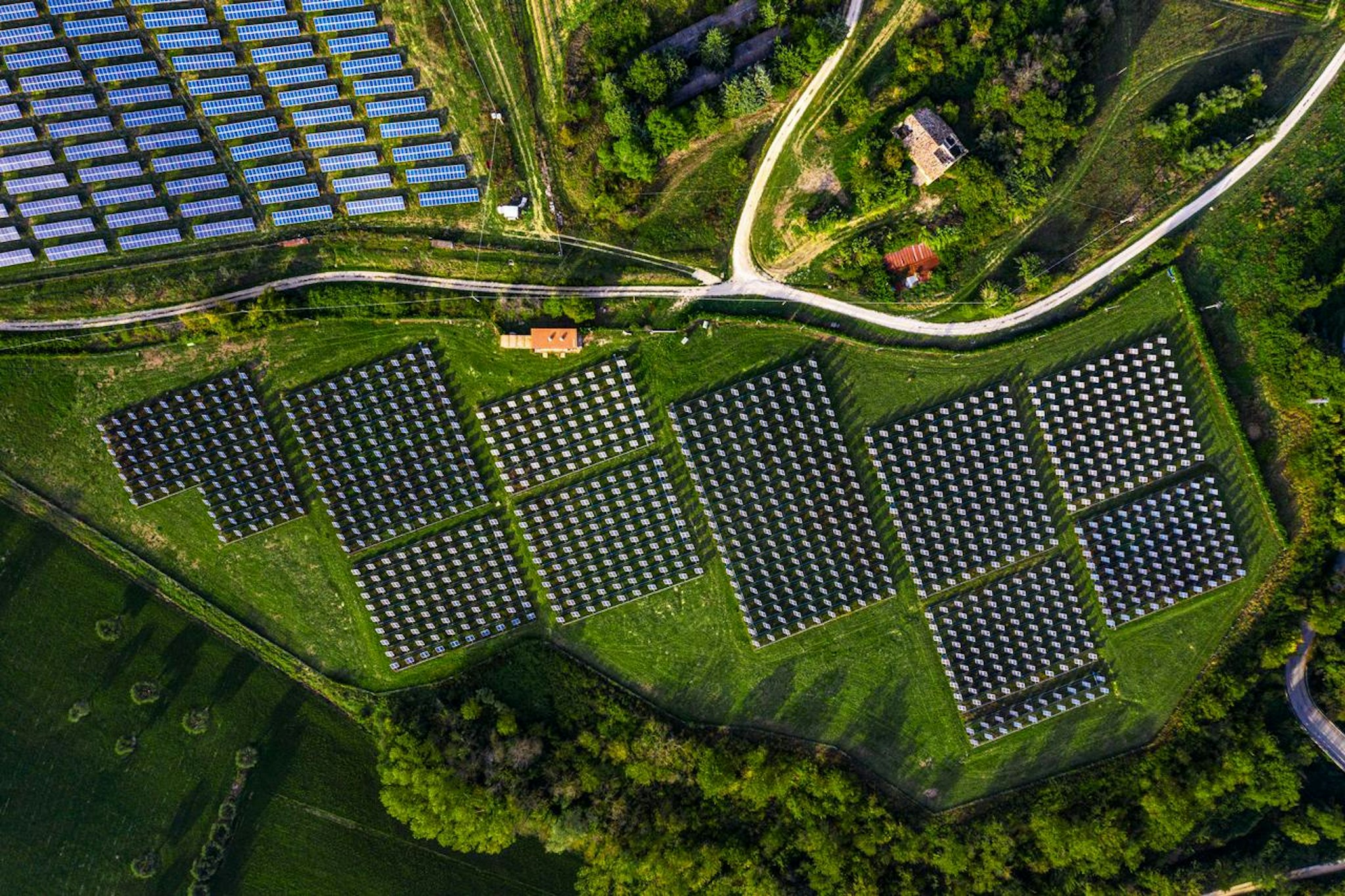 renewable energy solar panels in a green field
