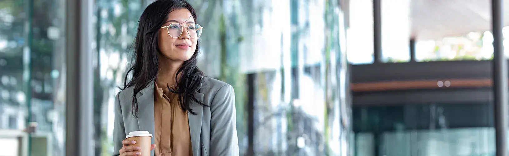 Woman looking away from camera and considers how to manage risk management during uncertainty